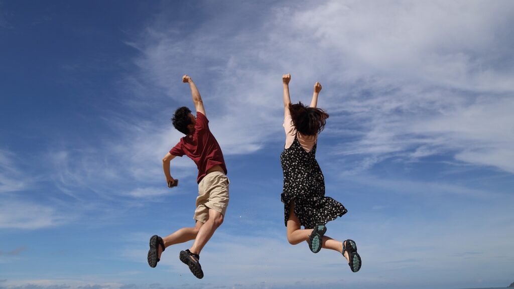 A man and a women expressing happiness